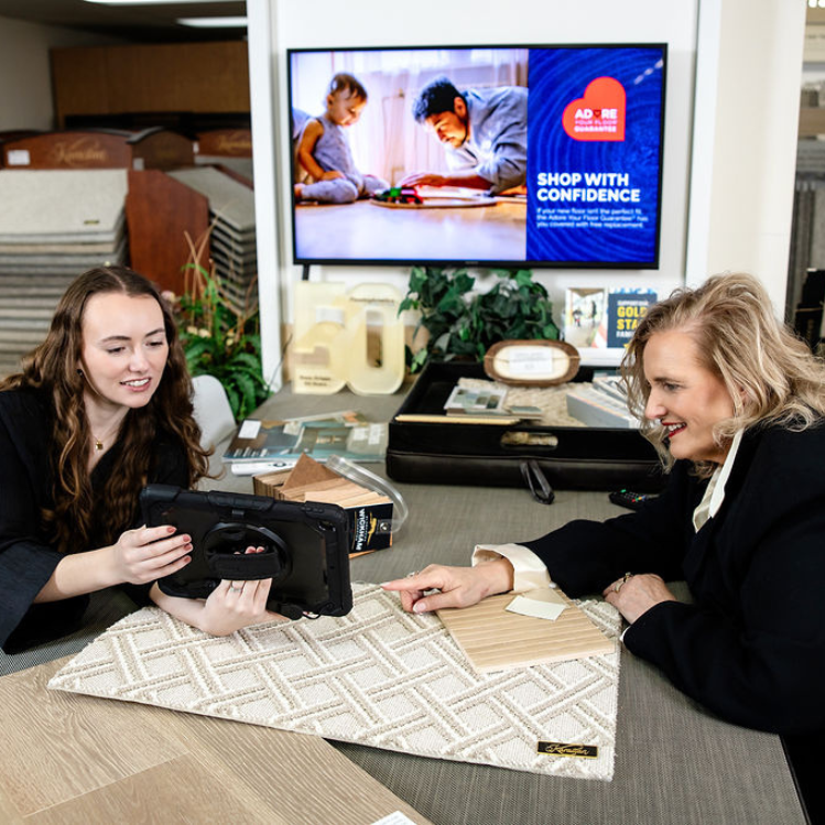 flooring and design specialists looking at carpet